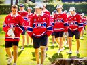 Nick Suzuki leads his team-mates after being named their new captain at the annual Montreal Canadiens golf tournament in Laval on Sept. 12, 2022.