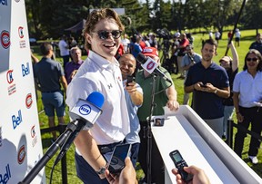 Montreal Canadiens forward Cole Caufield laughs with reporters prior to the team's annual golf tournament in Laval on Sept. 12, 2022.