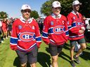 Canadiens' Nick Suzuki is flanked by assistant captains Joel Edmondson, right, and Brendan Gallagher after being named the team's captain at their annual golf tournament in Laval on Sept. 11, 2022. Gallagher should have been captain way back on Sept. 18, 2015, Jack Todd writes.