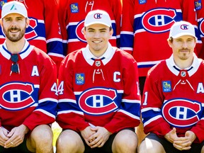 New captain Nick Suzuki poses for team photo with assistant captains Joel Edmundson (left) and Brendan Gallagher at Canadiens golf tournament at Laval-sur-le-Lac on Sept. 12.