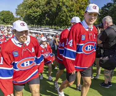 Nick Suzuki leads his team-mates after being named the team's new captain at their annual golf tournament in Laval, on Sept. 12, 2022.