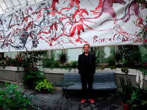Award-winning Montreal illustrator Bruce Roberts in 2014 with one of his famous horse drawings behind.