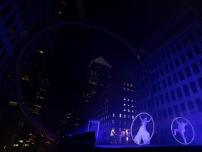 Circus performers entertain the crowd during an event to mark the 60th anniversary of Place Ville Marie, in Montreal on Wednesday, Sept. 14, 2022.