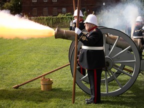 A bronze cannon is fired during a ceremony held at the Westmount Athletic Grounds to commemorate Queen Elizabeth II on Saturday, Sept. 17, 2022.