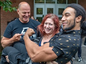 Rosemount High teacher Jessika Neri, mild-mannered teacher by day, feared wrestler Jessika Black by night, with wrestler Jacques Rougeau and hoisting up fellow wrestler Jeremy Prophet at Rosemount High in Montreal on Tuesday Sept. 20, 2022.