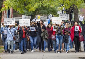 Demonstrators march on René-Lévesque Blvd. in Montreal on Wednesday, Sept. 21, 2022 in support of Mahsa Amini, a woman who died in police custody in Iran after her arrest for not wearing her hijab correctly.