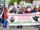 Demonstrators march in Montreal Wednesday September 21, 2022 in support of Mahsa Amini, the Iranian woman who died in police custody in Iran after her arrest for not wearing her hijab correctly. 