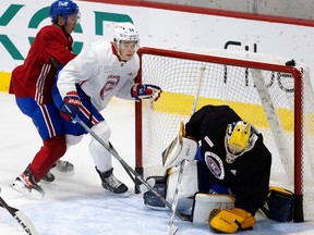 Jordan Harris of the Montreal Canadiens is pushed into the net during the final practice of the Junior Camp in Montreal on September 20, 2022.