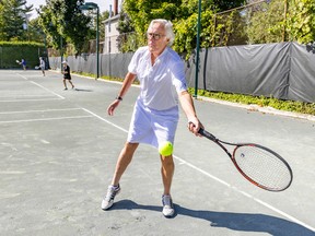 Valois Tennis Club manager Tom Brown hits a forehand on a court at the club in Pointe-Claire on Friday, Sept.  16, 2022.