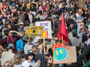 People take part in a climate march along Parc Ave. in Montreal on Friday, September 23, 2022.