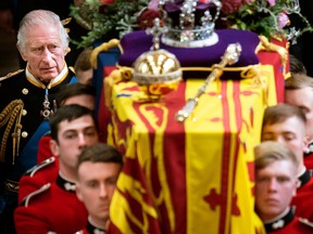 King Charles III and members of the Royal family follow behind the coffin of Queen Elizabeth II at her state funeral Monday. Despite Canadians' affection for the Queen, they have mixed views about the future of the monarchy in Canada.