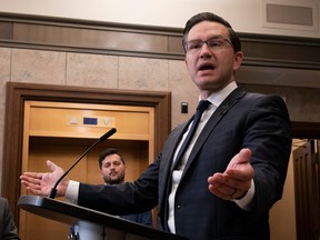 Conservative Leader Pierre Poilievre responds to a reporter's question in the foyer of the House of Commons on Sept. 13.