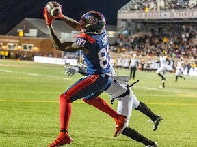 Montreal Alouettes Eugene Lewis catches the game-winning pass from quarterback Trevor Harris over Hamilton Tiger-Cats defensive back Richard Leonard during second half of Canadian Football League game in Montreal Sept. 23, 2022.