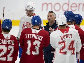 Montreal Canadiens head coach Martin St-Louis talks with his players during first day of training camp in Brossard on Sept. 22, 2022.