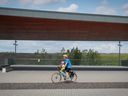 A cyclist gets a few minutes of exercise near the outdoor stage at Montreal's Frederic-Back Park. 