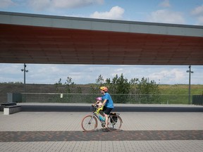 A cyclist gets in some exercise minutes near the open-air stage at Frederic-Back Park in Montreal.