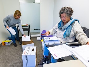 Lisa MacMartin, left, an Argyle Institute board director, and psychologist Lise Bourke sort files on Friday, Sept. 23, 2022.