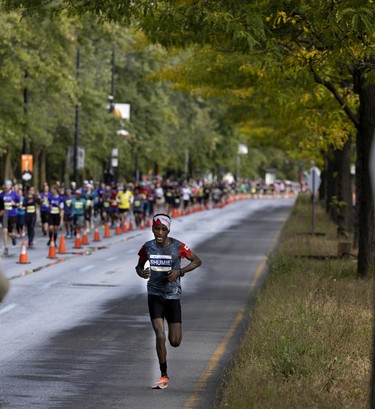 An elite runner has a section of the road to himself during the Montreal marathon on Sept. 25, 2022.
