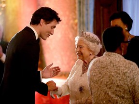 Elizabeth II greets Prime Minister Justin Trudeau in a receiving line for the Queen's Dinner for the Commonwealth Heads of Government Meeting (CHOGM) at Buckingham Palace on April 19, 2018 in London.