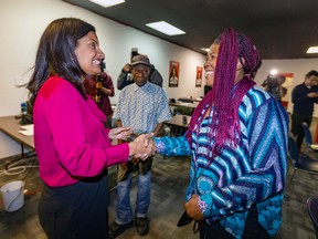 Quebec Liberal Party Leader Dominique Anglade, left, greets volunteers at her riding office in St-Henri Sept. 26, 2022.