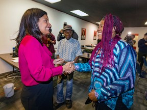 Quebec Liberal Party Leader Dominique Anglade, left, greets volunteers while visiting her riding office in St-Henri on Monday, September 26, 2022.
