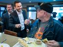Parti Québécois Leader Paul St-Pierre Plamondon chats with Albert Michaud at a restaurant in Mascouche on Tuesday, September 27, 2022.