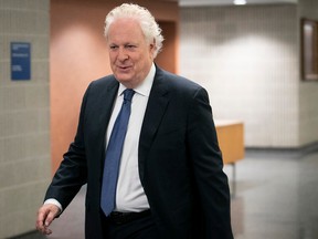 Former Quebec premier Jean Charest arrives at the Palais de Justice for the resumption of his civil trial on Wednesday Sept. 28, 2022. Charest sued the Quebec government over UPAC leaks.