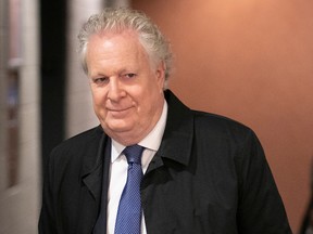 Jean Charest arrives at the Montreal courthouse Wednesday. In testimony, he described the leaks coming out of UPAC as "systemic."