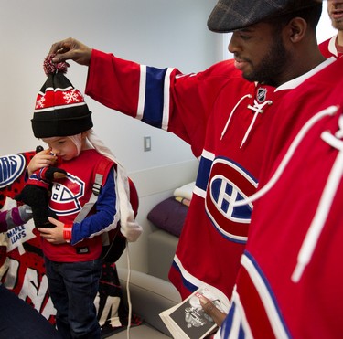 P.K. Subban tugs on Maxence Gosselin's hat as Montreal Canadiens players visit the Montreal Children's Hospital on Dec. 8, 2015.