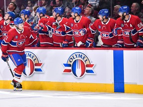 Kaiden Guhle of the Montreal Canadiens celebrates his goal with teammates on the bench against the Winnipeg Jets during the first period at Centre Bell on Thursday, Sept. 29, 2022 in Montreal.