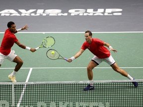 Félix Auger-Aliassime and Vasek Pospisil of Canada in action against Jisung Nam and Min-Kyu Song of Korea Republic during the Davis Cup Group Stage 2022 Valencia match at Pabellon Fuente De San Luis on Sept. 13, 2022 in Valencia, Spain.