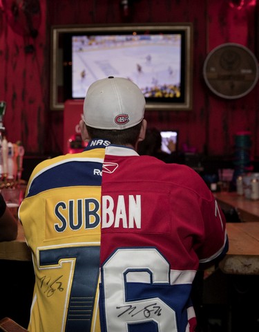 Pierre-Luc Cantin watches PK Subban play in the opening game of the Stalely Cup finals at Chez Serge in Montreal on May 29, 2017.