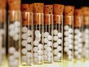 Vials containing pills for homeopathic remedies are displayed in London pharmacy.