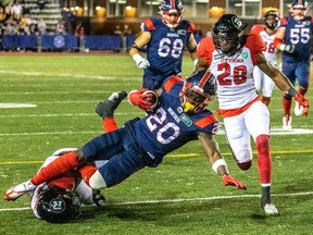 Montreal Alouettes rusher Jeshrun Antwi is tackled during first half against Ottawa Redblacks at Percival Molson Stadium in Montreal on Sept.  2, 2022.