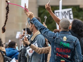 A human chain was organized at the Roddick Gates at McGill University in Montreal on Tuesday September 27, 2022 in support of protests against the death of Mahsa Amini.