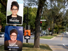 Election posters in the Maurice-Richard riding in Montreal for the Quebec election on Oct. 3. Combined the five main parties have nominated a record proportion of female candidates — about 46 per cent in all.