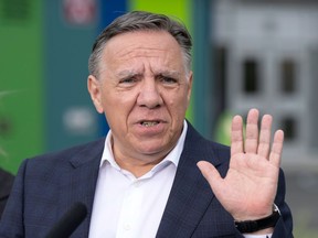 Coalition Avenir du Quebec Leader François Legault speaks to the media while campaigning Wednesday, August 31, 2022 in Montreal. Quebec votes in the provincial election Oct. 3.