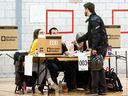 A man casts his ballot at a polling station in the provincial elections on October 1, 2018 in Montreal,  Quebec.