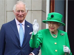 In this file photo taken on June 5, 2022, Queen Elizabeth II stands beside Prince Charles, Prince of Wales, as she appears on the balcony at Buckingham Palace at the end of the Platinum Pageant in London.