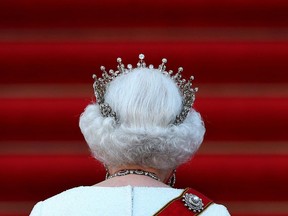 In this file photo taken on June 24, 2015 Britain's Queen Elizabeth II arrives for a receiving line and state banquet with German President Joachim Gauck at the presidential Bellevue Palace in Berlin. (Photo by Saul LOEB and Ronny HARTMANN / AFP)