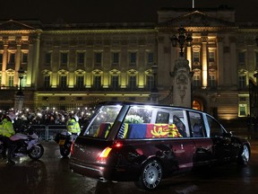 The Royal Hearse carrying the coffin of Queen Elizabeth II arrives at Buckingham Palace on Sept. 13, 2022 in London.