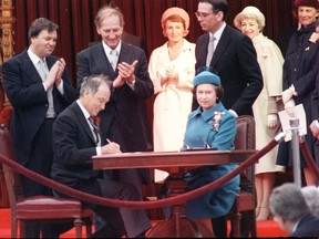 To legally end the monarchy in Canada we must reignite a dangerous, explosive substance that’s been hidden away for our safety: the Constitution, writes Josh Freed. Above, Queen Elizabeth II and Prime Minister Pierre Trudeau sign Canada's constitutional proclamation in Ottawa on April 17, 1982.