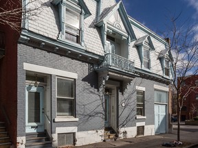 A series of older, grey rowhouses