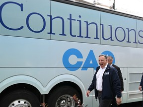 Coalition Avenir Québec Leader François Legault walks out of his campaign bus, Sunday, September 18, 2022 in Quebec City. Quebecers go to the polls for a general election on Oct. 3.