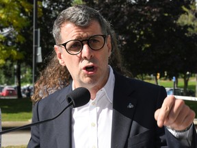 Quebec Conservative Leader Éric Duhaime responds to reporters' questions at a news conference at a bus terminal, Tuesday, September 27, 2022  in Quebec City. Duhaime spoke about his opposition to the tramway project.