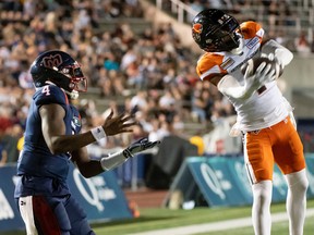 B.C. Lions’ Garry Peters (1) intercepts a pass intended for Montreal Alouettes’ Dominique Davis (4) during first half CFL football action in Montreal on Friday, September 9, 2022.