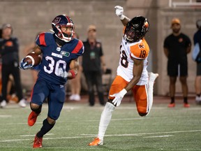 B.C. Lions' Hakeem Johnson (18) runs after Montreal Alouettes' Chandler Worthy (30) during first half CFL football action in Montreal on Friday, September 9, 2022.