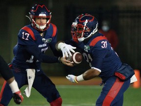 Running-back William Stanback, seen taking a handoff from quarterback Trevor Harris, had a league-leading 1,176 yards rushing last season and was the East Division's nominee as most outstanding player.