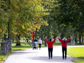 One couple power walks while another walks with their baby on a mild afternoon in Verdun Sept. 28, 2022.