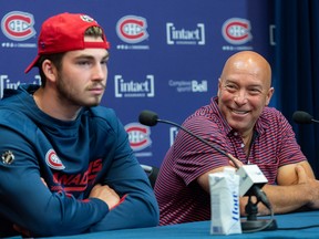 Montreal Canadiens general manager Kent Hughes, right,  speaks during a news conference alongside forward Kirby Dach in Brossard on Sept. 7, 2022. Dach has agreed to terms on a US$13.45-million, four-year contract with Montreal.